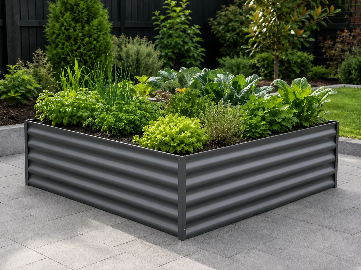 Corrugated steel raised garden bed filled with herbs and vegetables